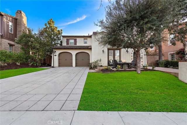 mediterranean / spanish house with a front yard