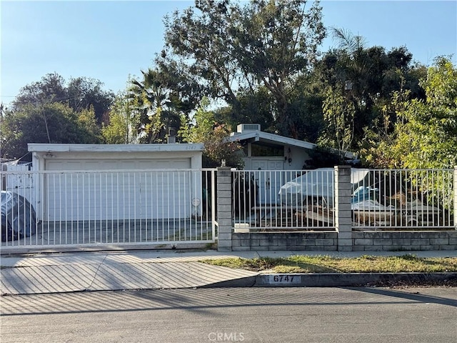 view of gate featuring a garage