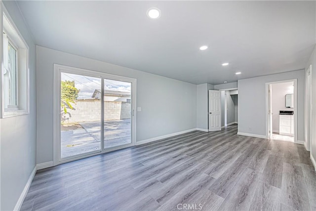 unfurnished living room with light hardwood / wood-style flooring