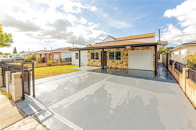 single story home featuring a garage and a front yard