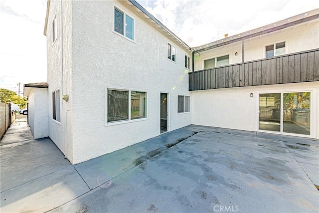 rear view of house featuring a patio