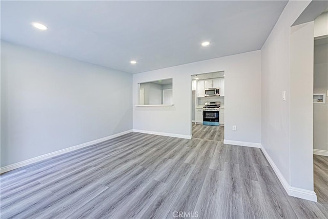 unfurnished living room with light wood-type flooring