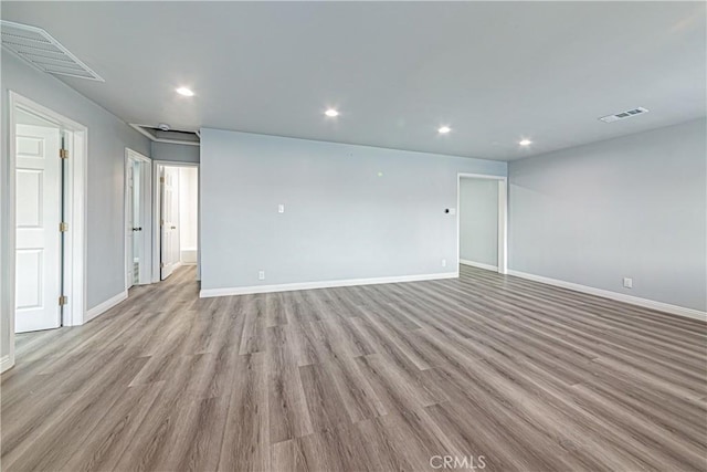 empty room with light hardwood / wood-style flooring