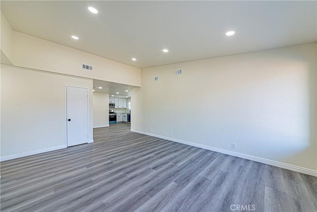 empty room featuring dark hardwood / wood-style flooring