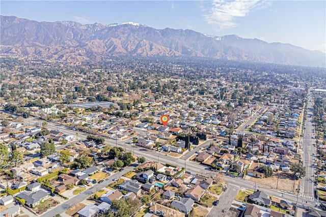 drone / aerial view featuring a mountain view