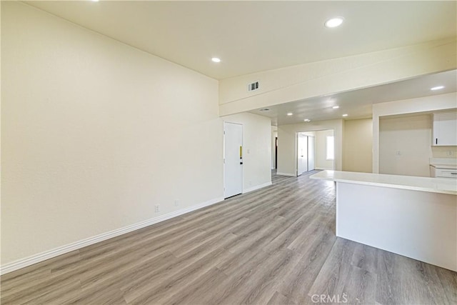 unfurnished living room with light hardwood / wood-style floors