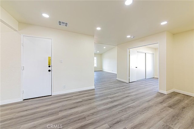 unfurnished room featuring light hardwood / wood-style flooring