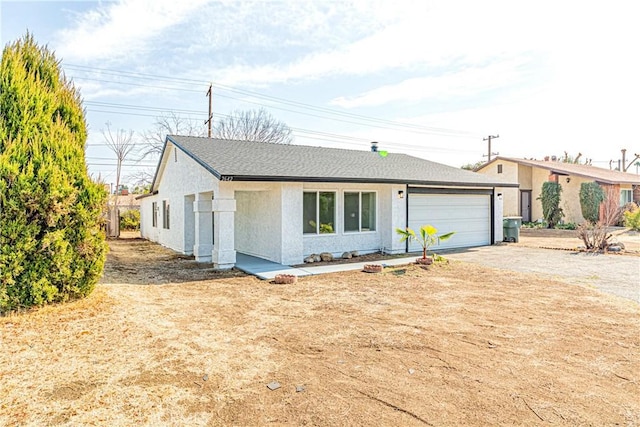 ranch-style home featuring a garage