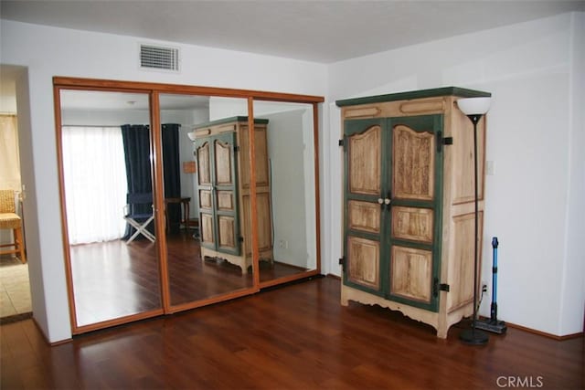 entryway with dark wood-type flooring