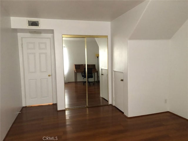 hall featuring dark wood-type flooring