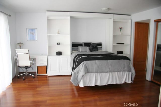 bedroom featuring wood-type flooring