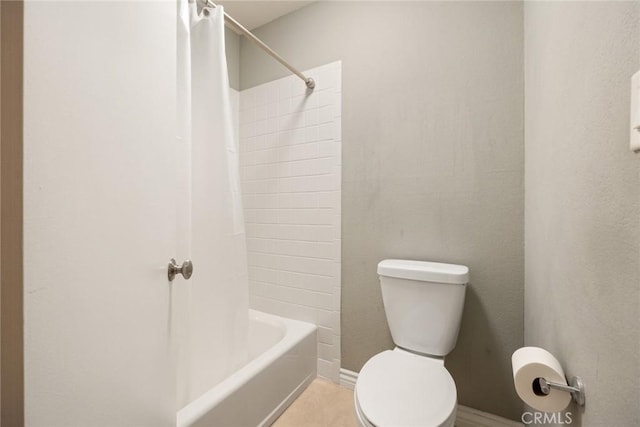 bathroom with shower / bath combo and toilet