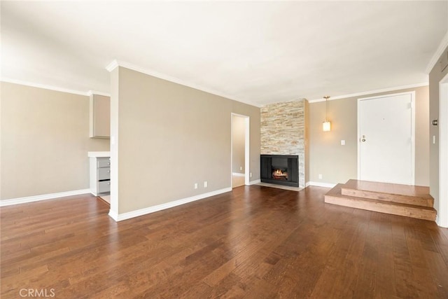 unfurnished living room with a fireplace, ornamental molding, and dark hardwood / wood-style floors