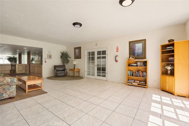 living area with light tile patterned flooring and french doors