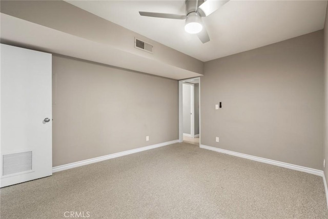 unfurnished room featuring ceiling fan and carpet