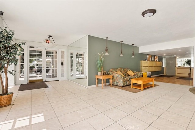 living room with light tile patterned floors and french doors