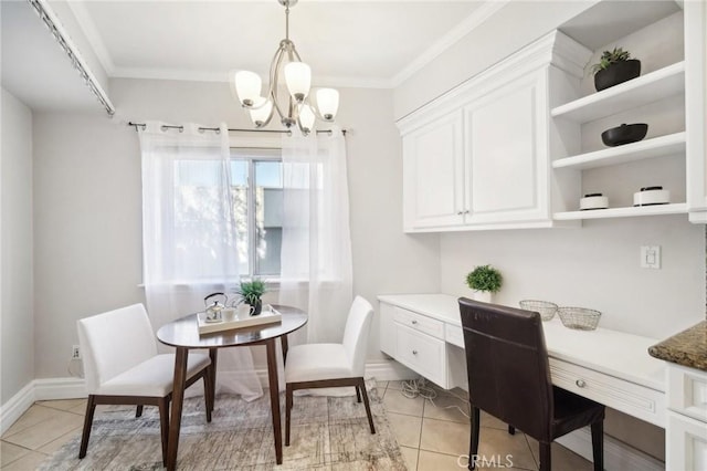 dining room with ornamental molding, built in desk, light tile patterned flooring, and an inviting chandelier