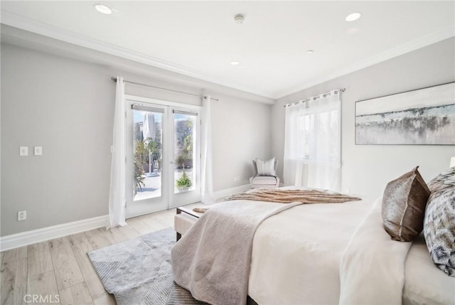 bedroom with ornamental molding, light hardwood / wood-style floors, and access to outside