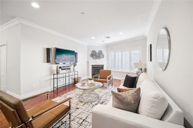 living room featuring ornamental molding and hardwood / wood-style floors