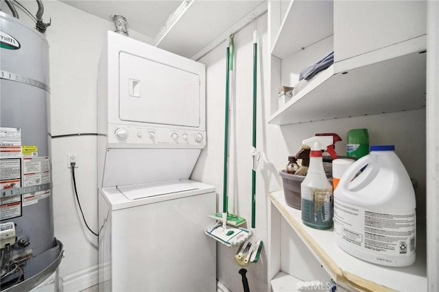 laundry area with stacked washer and clothes dryer and strapped water heater