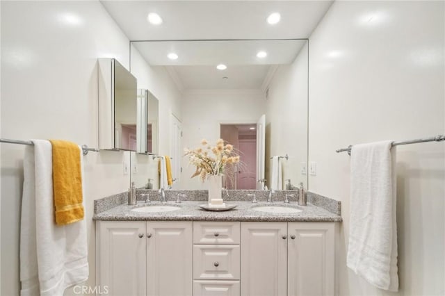 bathroom featuring vanity and crown molding