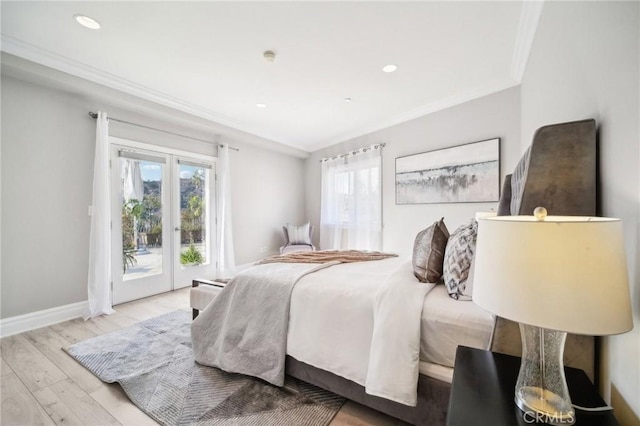 bedroom with french doors, ornamental molding, light hardwood / wood-style flooring, and access to outside