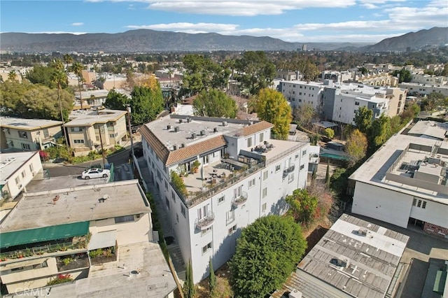 birds eye view of property with a mountain view