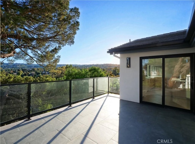 view of patio with a balcony