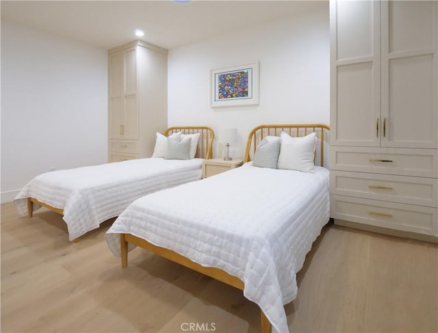 bedroom featuring light wood-type flooring