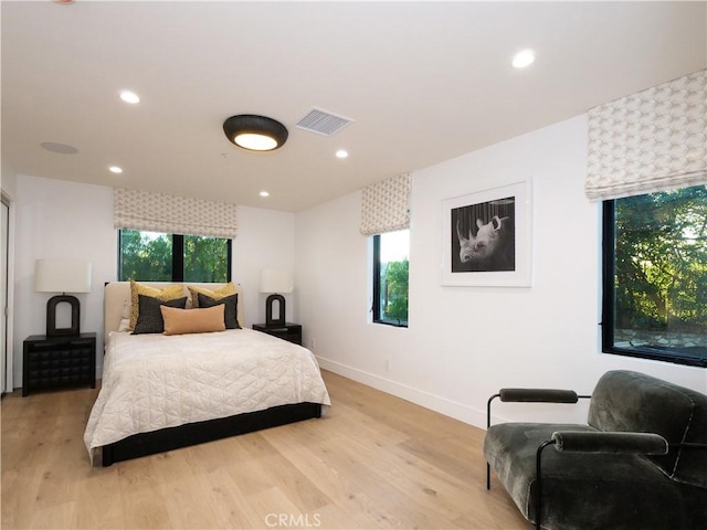 bedroom with light hardwood / wood-style floors