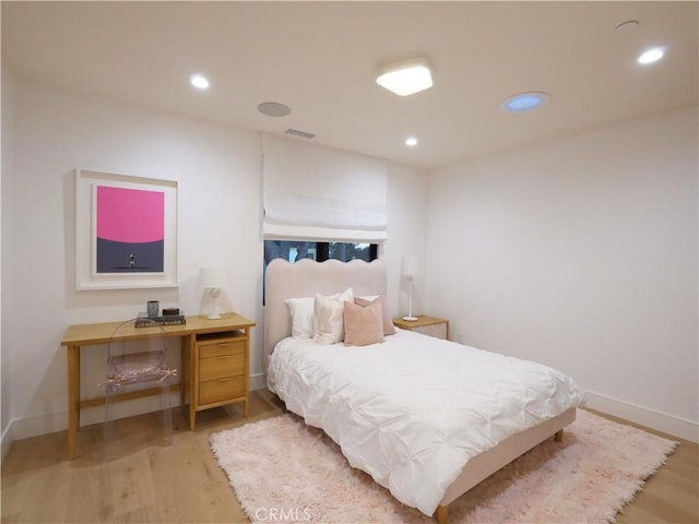 bedroom with light wood-type flooring