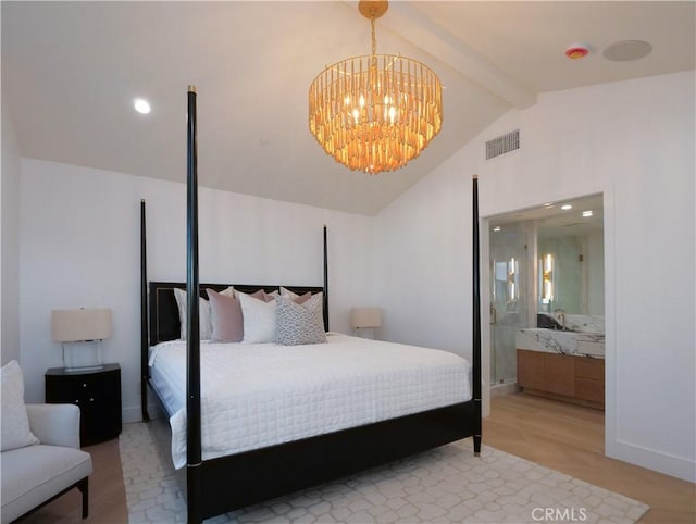 bedroom with connected bathroom, vaulted ceiling with beams, and a chandelier