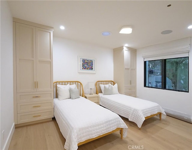 bedroom with light hardwood / wood-style flooring