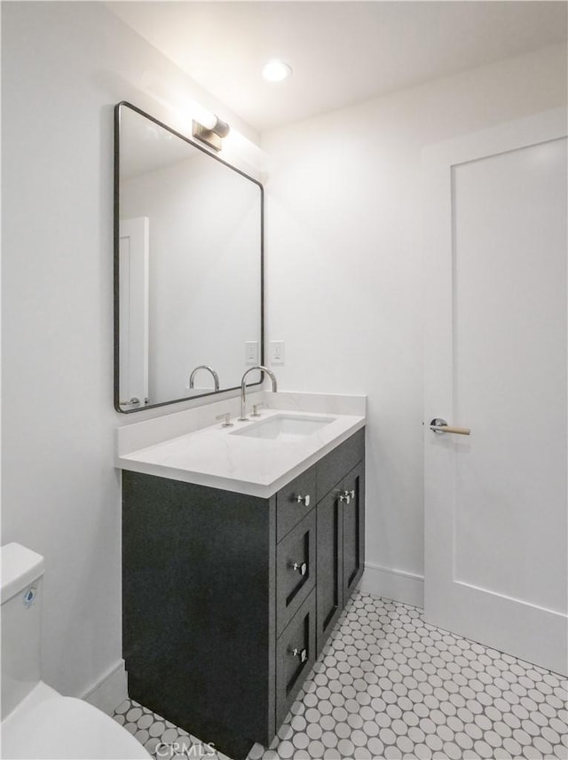 bathroom with vanity and toilet