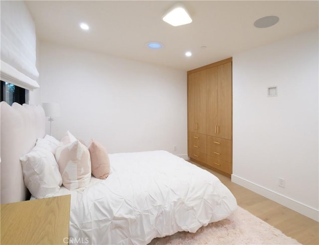 bedroom featuring light hardwood / wood-style flooring