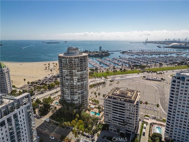 bird's eye view with a water view and a view of the beach