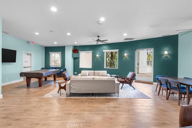 living room featuring light hardwood / wood-style flooring, billiards, and ceiling fan