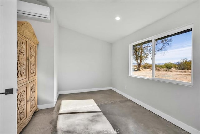 spare room featuring a wall mounted air conditioner