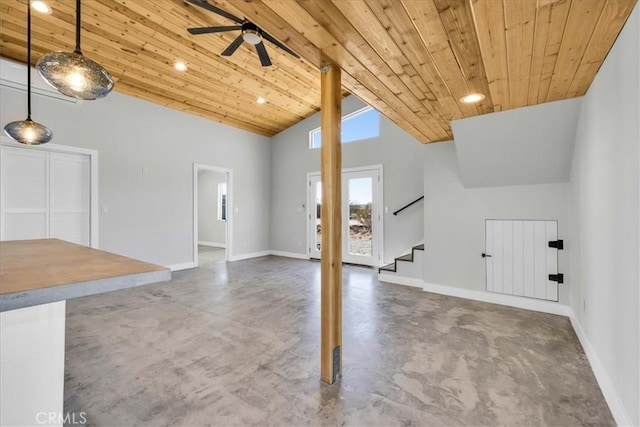 unfurnished living room with concrete flooring, ceiling fan, wooden ceiling, and high vaulted ceiling