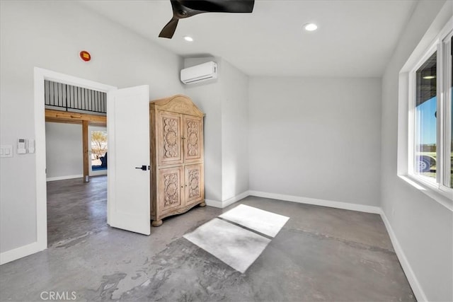 empty room with ceiling fan, lofted ceiling, concrete flooring, and a wall mounted AC