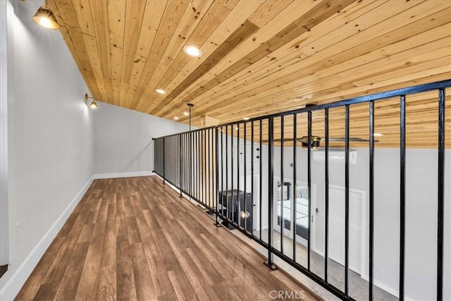 hall with hardwood / wood-style floors and wooden ceiling