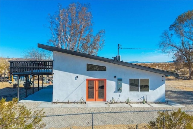 back of property featuring french doors