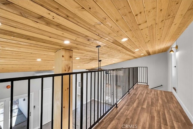 corridor featuring hardwood / wood-style flooring and wood ceiling