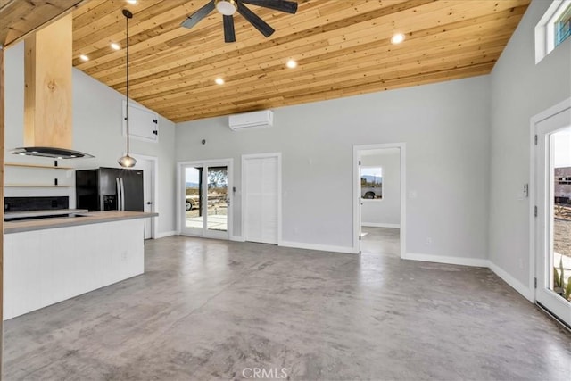 unfurnished living room featuring high vaulted ceiling, concrete floors, wooden ceiling, a wall unit AC, and ceiling fan