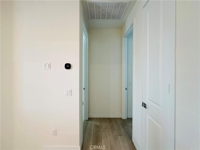 corridor featuring hardwood / wood-style flooring