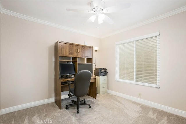 carpeted office space featuring crown molding and ceiling fan