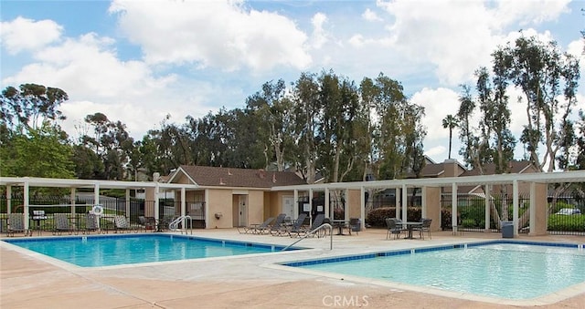 view of swimming pool with a patio