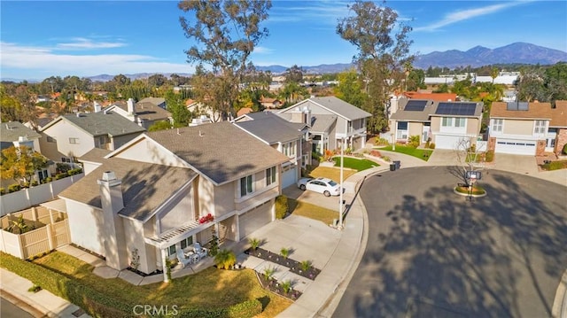 birds eye view of property with a mountain view