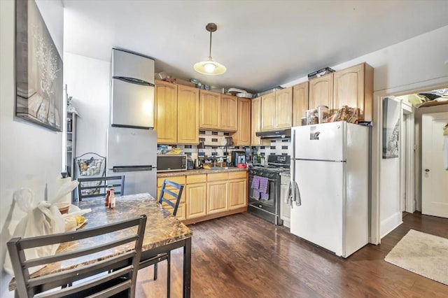 kitchen featuring dark wood-type flooring, light brown cabinets, pendant lighting, stainless steel appliances, and backsplash