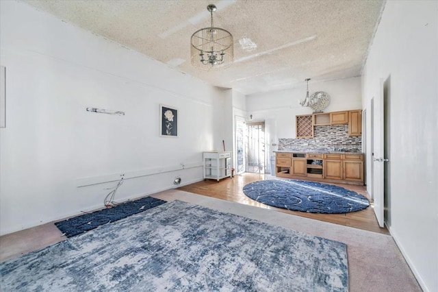 bedroom with a notable chandelier and a textured ceiling